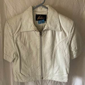 White soft leather made miniskirt and jacket has been professionally cleaned.